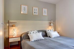 Ένα ή περισσότερα κρεβάτια σε δωμάτιο στο Zum Sandstrand sind es wenige Gehminuten - genießen Sie aber auch die Zeit am Pool +15 φωτογραφίες