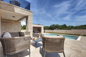 Fotografie z fotogalerie ubytování Villa mit privatem Pool, WLAN, 4 Klimas und tollem BBQ-Bereich v destinaci Loborika