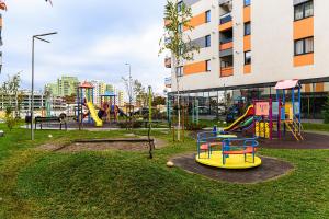 a park with a playground with a slide at Grandis Residence Apartment in Braşov