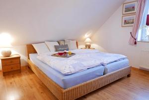 Postel nebo postele na pokoji v ubytování Apartments Kirsebek