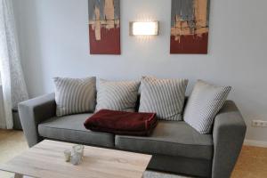 a living room with a couch and a table at Seestern in Kappeln