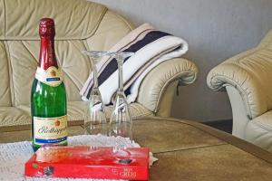 a bottle of champagne and glasses on a table at Mee(h)r in Hasselberg +15 photos