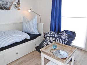 a bedroom with a bed and a table at Flow in Kappeln