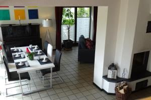 a living room with a table and a couch at Vincent in Kappeln