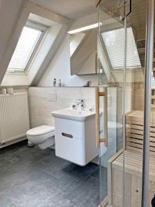 a bathroom with a sink and a toilet at Stadtoase in Süderbrarup