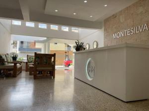 a lobby of a museum with a sign on the wall at Hotel Montesilva in San Felipe de Puerto Plata