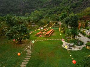 a park with a bunch of benches and lights at THE GOAT BOUTIQUE RESORT in Ninh Binh