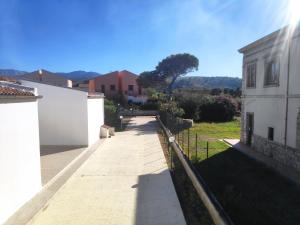 a view of a pathway between two buildings at Campofelice Holidays in Campofelice di Roccella