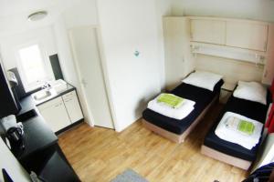 Ένα ή περισσότερα κρεβάτια σε δωμάτιο στο Mobilheime Kahl - Studio ATHEN