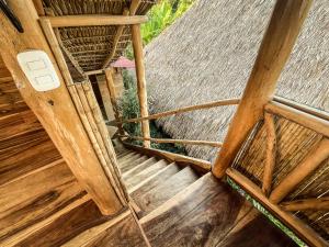 an overhead view of a wooden stairs in a building at Casa La Aventura Guasacate - Popoyo in Popoyo