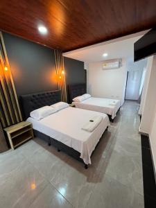 Voodi või voodid majutusasutuse Hotel Almalu toas