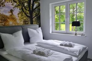 Postel nebo postele na pokoji v ubytování Muehlenblick 4 - Traumhaft im Luftkurort