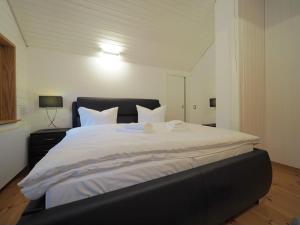 Ein Bett oder Betten in einem Zimmer der Unterkunft Ferienhaus Marie
