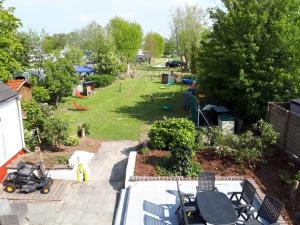 an aerial view of a backyard with a park at Wohnung 2 in Fedderwardersiel