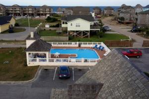 an aerial view of a house with a swimming pool at Hatteras Island Inn in Buxton