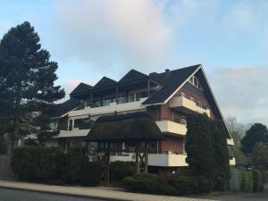 a large apartment building with a black roof at Baltic Nr. 21 in Scharbeutz