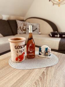 a bottle of cough syrup sitting on top of a table at Haus Larum App. 5 in Scharbeutz