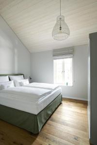 מיטה או מיטות בחדר ב-Ferienwohnung Meta