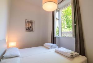 Postel nebo postele na pokoji v ubytování Villa Perondi