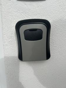 a black and white handle on a white wall at Catch n relax in Kalabaka