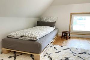 En eller flere senge i et værelse på Haus Landglück