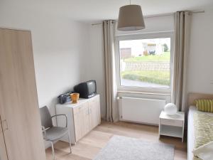 TV a/nebo společenská místnost v ubytování NEU! Ferienhaus Schaaf