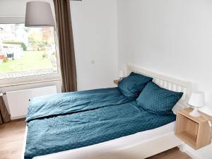 Postel nebo postele na pokoji v ubytování NEU! Ferienhaus Schaaf