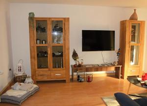 a living room with a flat screen tv on a wall at NEU! Ferienwohnung Milo Pfälzer Wald in Rodalben