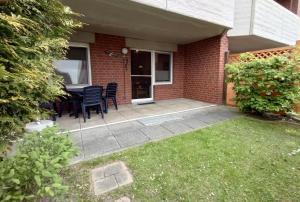 O grădină în afara Ferienwohnung Regina an der Nordsee No 5