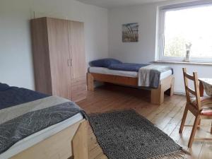 Ένα ή περισσότερα κρεβάτια σε δωμάτιο στο NEU! Ferienwohnung Maja