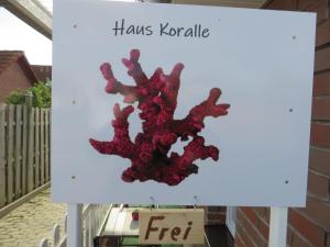 a sign that says thanks kryptamine with a coral at Neu Haus Koralle an der Nordsee in Dornumergrode