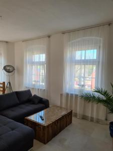 Posezení v ubytování NEU! Ferienwohnung in Mücheln mit Balkon