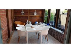 Balkón nebo terasa v ubytování Ferienhaus Fahrrinne 44