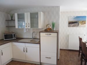 Kuchyň nebo kuchyňský kout v ubytování NEU! Landhaus Lüttje Nüst