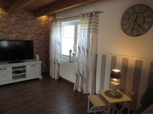 TV a/nebo společenská místnost v ubytování NEU! Landhaus Lüttje Nüst