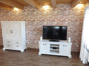 TV a/nebo společenská místnost v ubytování NEU! Landhaus Lüttje Nüst