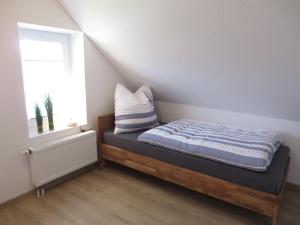 Postel nebo postele na pokoji v ubytování NEU! Landhaus Lüttje Nüst