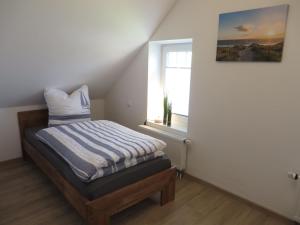 Postel nebo postele na pokoji v ubytování NEU! Landhaus Lüttje Nüst