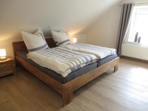 Postel nebo postele na pokoji v ubytování NEU! Landhaus Lüttje Nüst