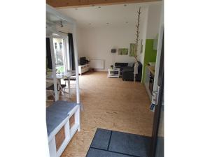 a view of a living room from the hallway at NEU Apartment am Birkenfeld Allgäu Kaufbeuren in Steinholz