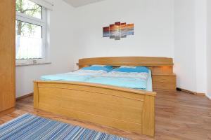 Postel nebo postele na pokoji v ubytování NEU! Ferienhaus Nordseewind