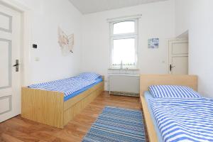 Postel nebo postele na pokoji v ubytování NEU! Ferienhaus Nordseewind