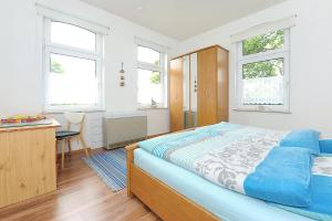Postel nebo postele na pokoji v ubytování NEU! Ferienhaus Nordseewind