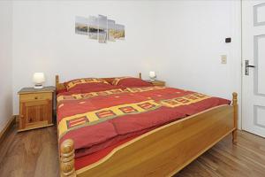 Postel nebo postele na pokoji v ubytování NEU! Ferienhaus Nordseewind
