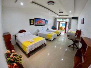 Voodi või voodid majutusasutuse Galápagos Isabela Hotel Loja toas