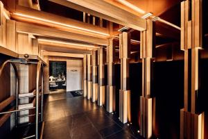 a hallway with wooden walls and wooden beams at Nobu Hotel San Sebastián in Donostia-San Sebastián