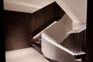 a white staircase in a room with wood at Nobu Hotel San Sebastián in Donostia-San Sebastián