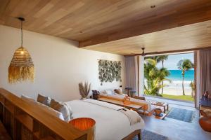 Postel nebo postele na pokoji v ubytování W Punta de Mita