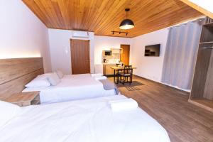 Postel nebo postele na pokoji v ubytování Chalés Estilo de Campos