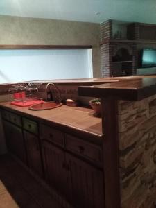 a kitchen with a counter top with a sink at El Celemín in Benalup Casas Viejas